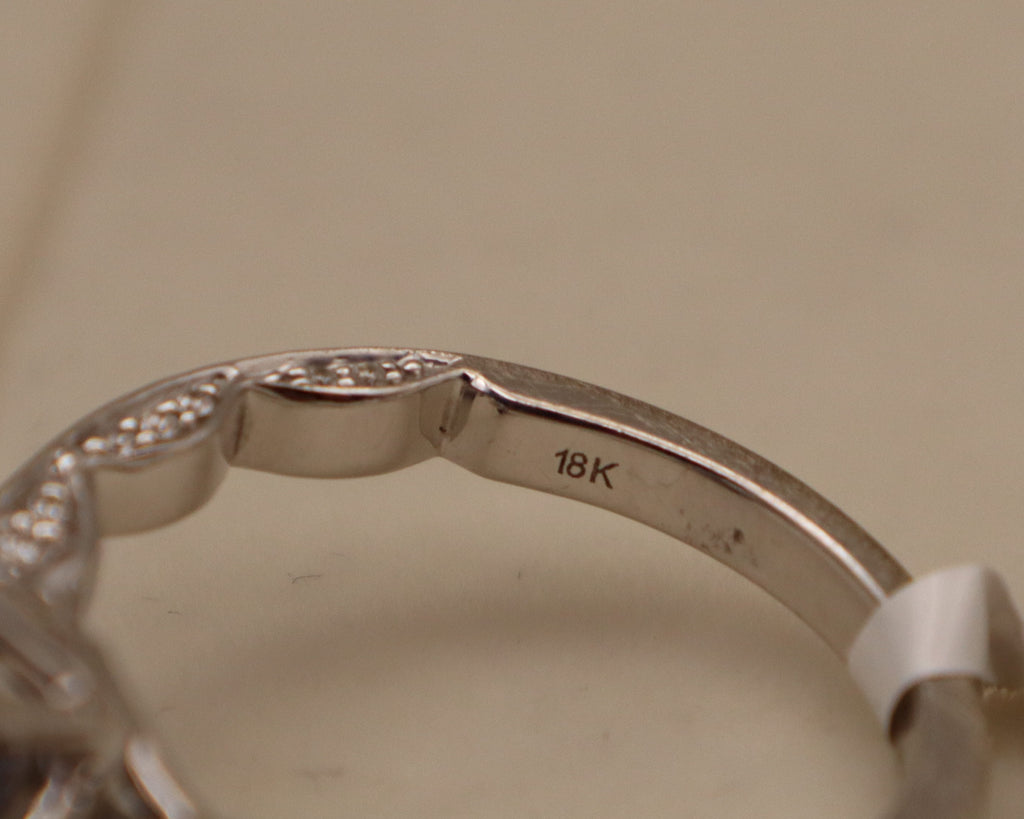 18k White Gold Oval Tanzanite and Diamond Ring